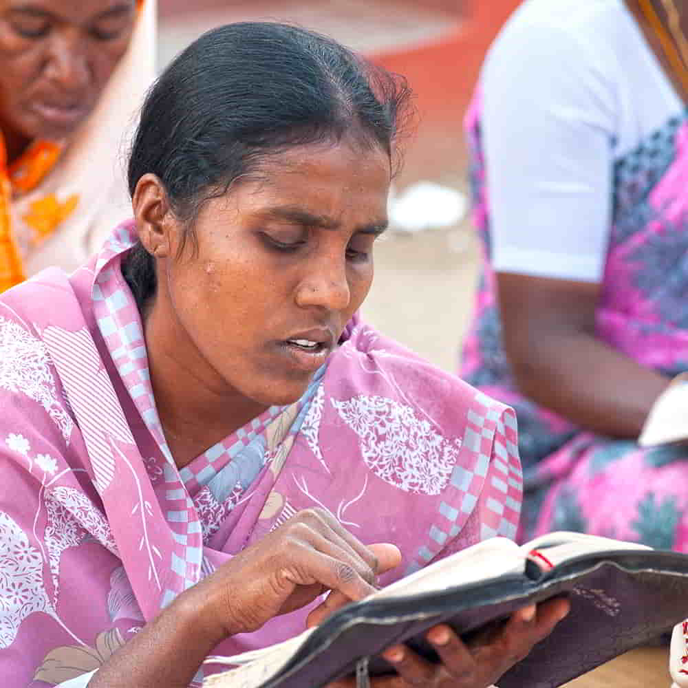 Woman learns to read her Bible through GFA World adult literacy class