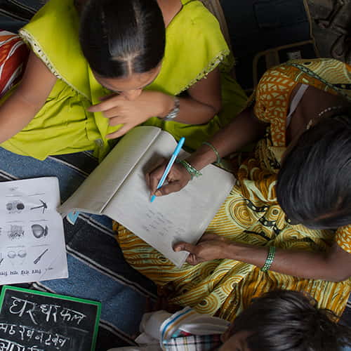 Women learn numeracy through GFA World adult literacy class