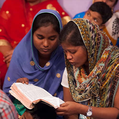 Women able to read a Bible thanks to GFA World adult literacy class