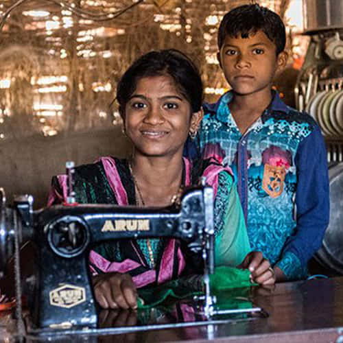 Like this daughter, Dayita received a sewing machine from GFA World gift distribution