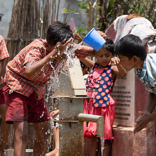 Children enjoying clean water through GFA World Jesus Wells
