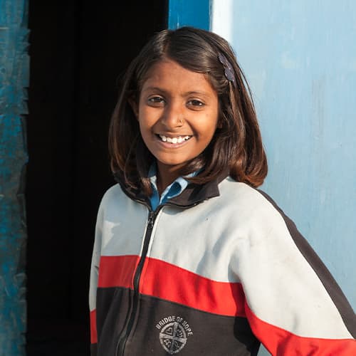 Girl wearing GFA World child sponsorship uniform