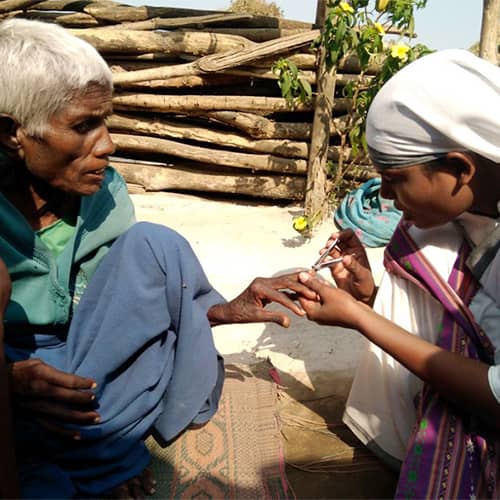 GFA World woman missionary provides treatment to Adey, a leprosy patient
