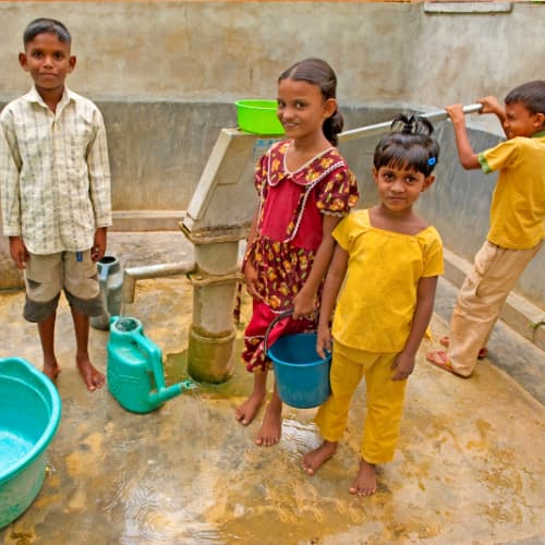 Children draw clean water through GFA World (Gospel for Asia) Jesus Wells