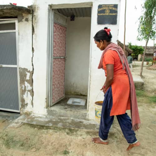 This woman and her family enjoys a sanitation facility through GFA World (Gospel for Asia) gift distribution