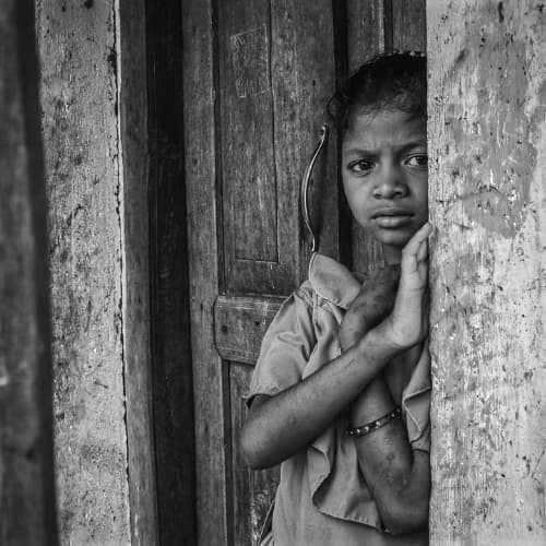 Like this girl from the slums of South Asia many children struggle with mental health issues