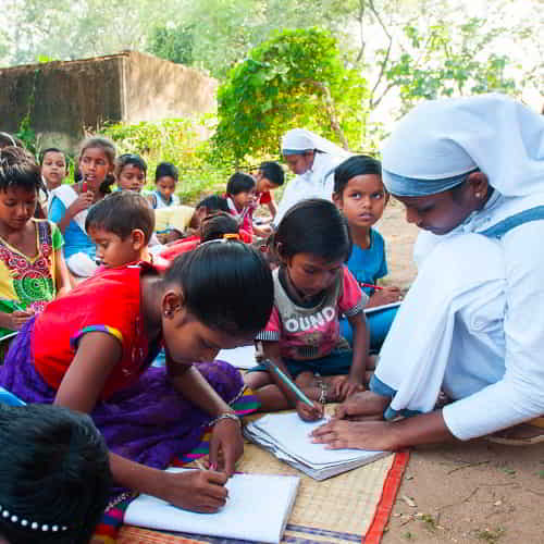 GFA World Sisters of Compassion are seen here taking turns teaching these children to read and write.