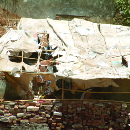 Tattered roof of an impoverished family in South Asia